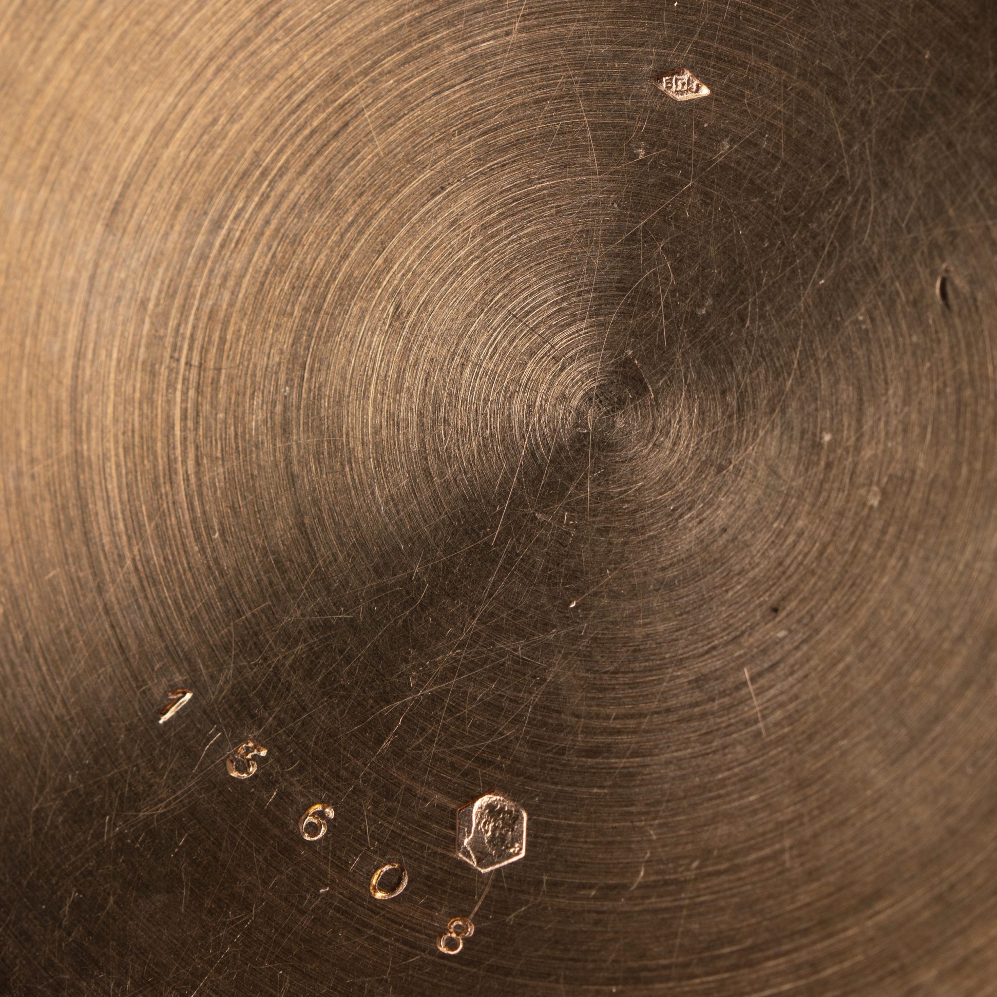 Edmond Jaeger's gold purity mark and makers mark inside case back of Cartier pocket watch.