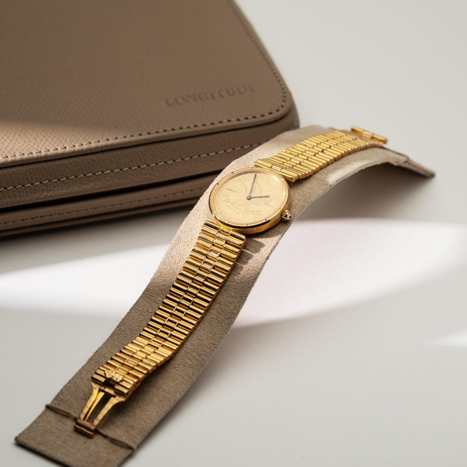 18k Corum Eagle Liberty-head coin watch.